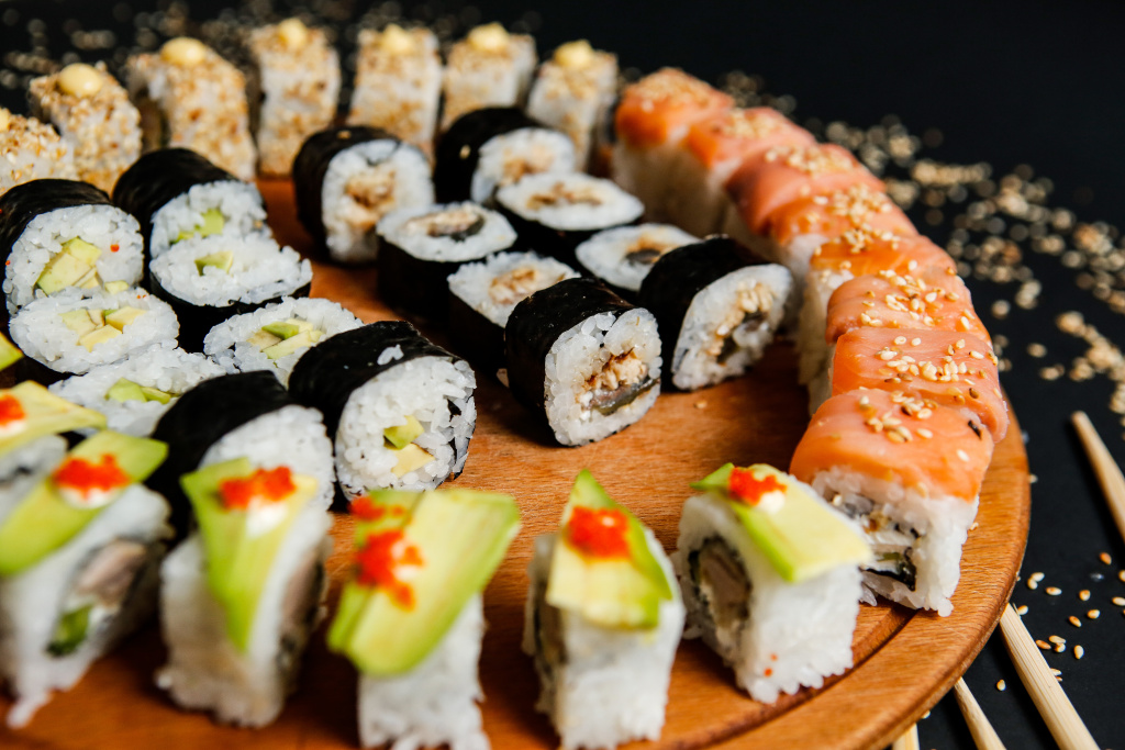 side-view-mix-sushi-rolls-with-avocado-sesame-seeds-chopsticks-stand.jpg side-view-mix-sushi-rolls-with-avocado-sesame-seeds-chopsticks-stand.jpg